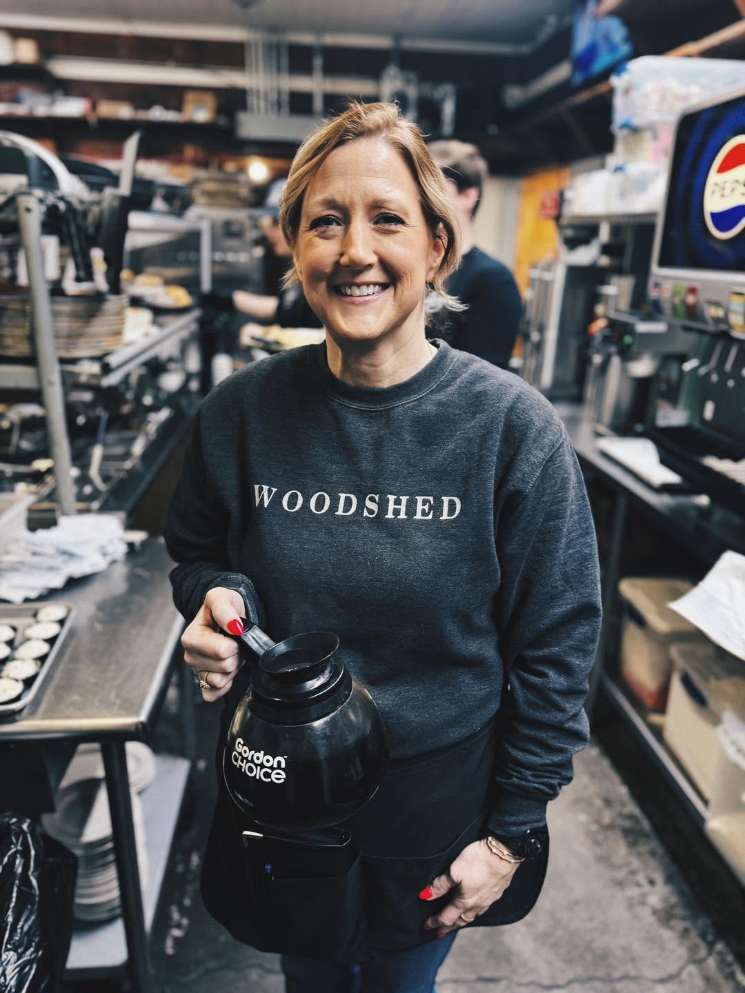 Woodshed team member with coffee service