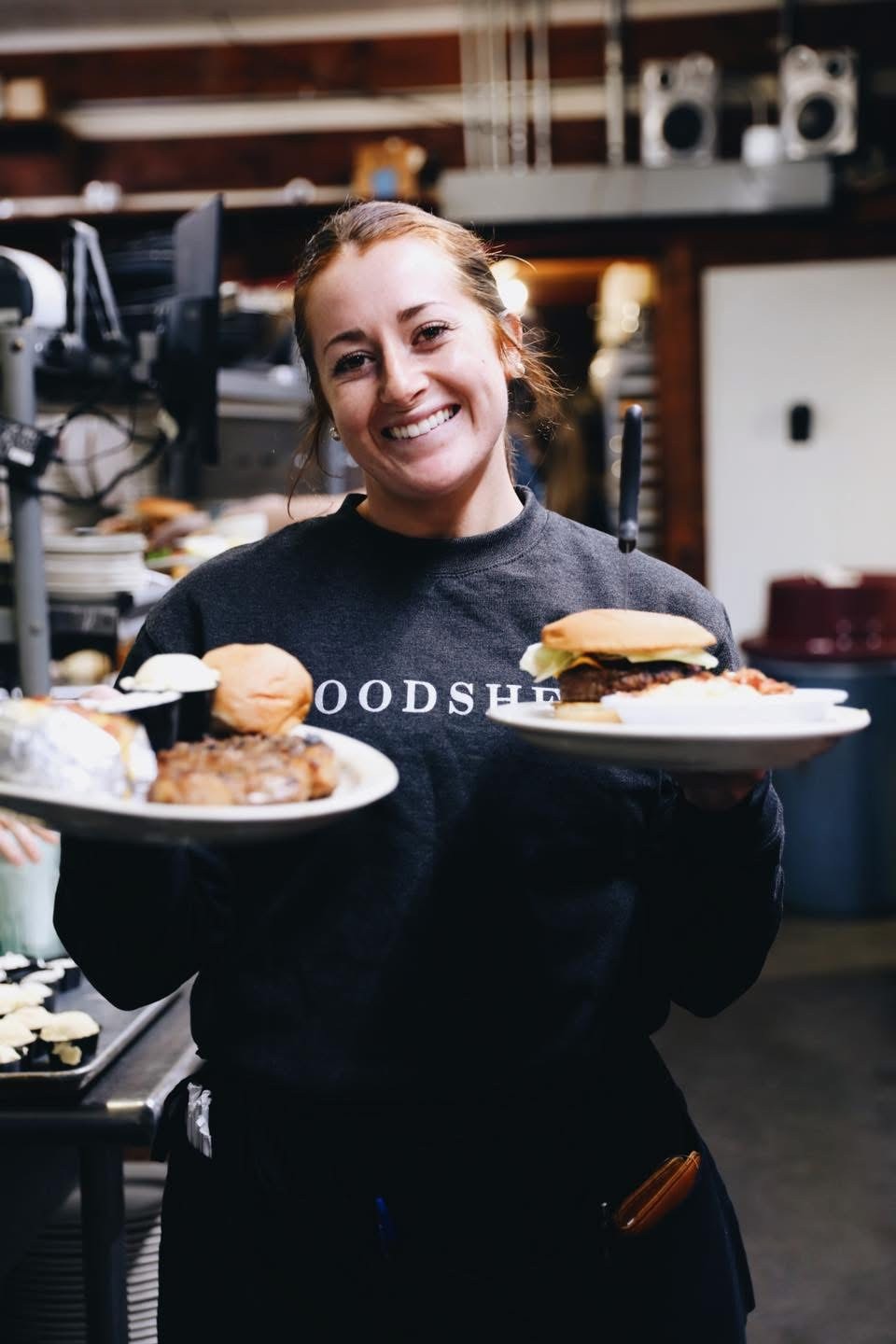 A friendly Woodshed team member ready to serve guests